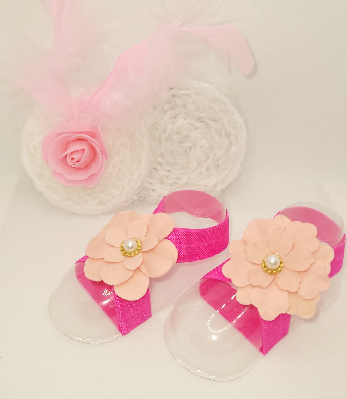 Soft pink and white bow with feathers