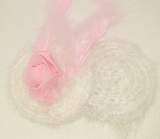 Soft pink and white bow with feathers